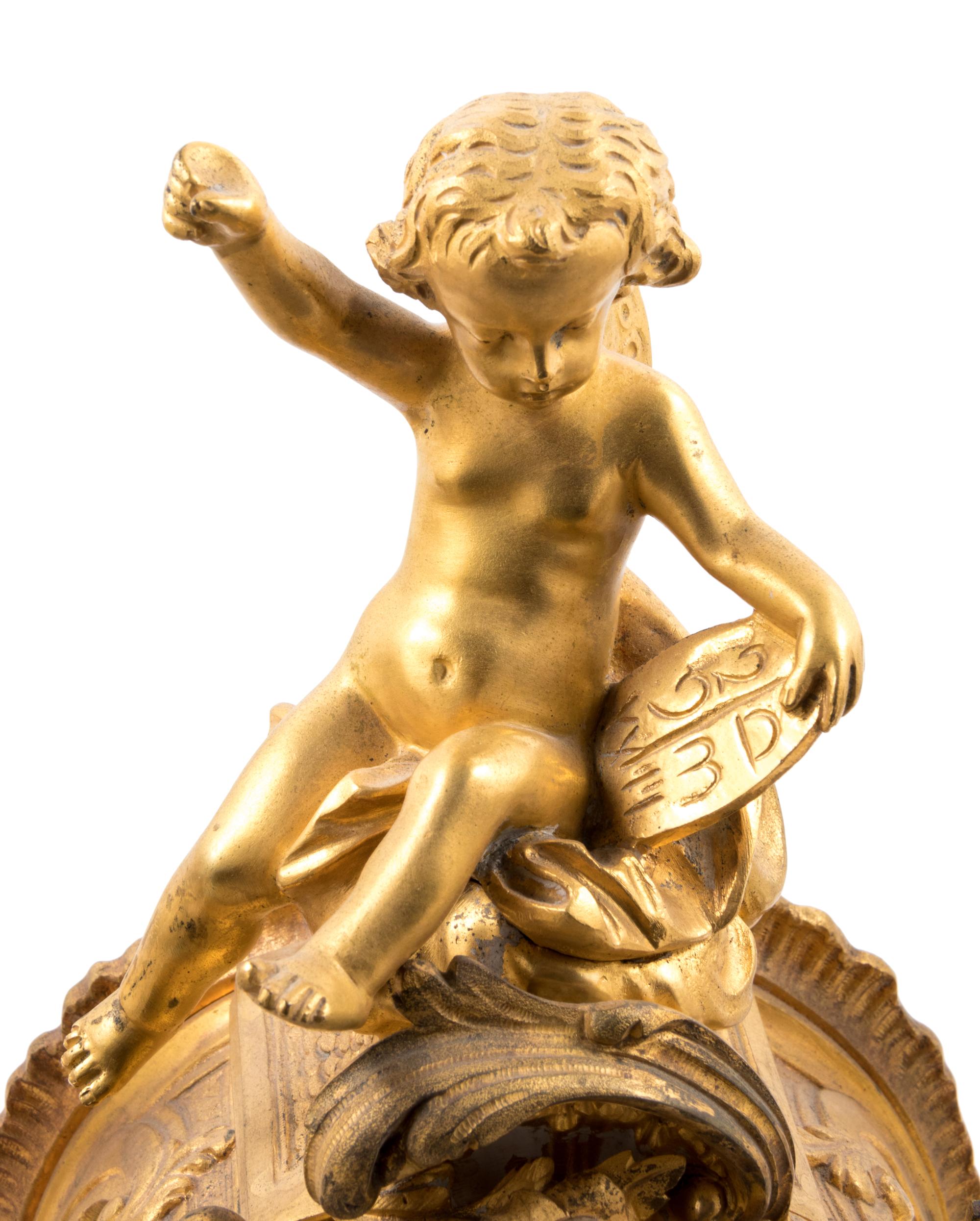 A Louis XV Style Gilt Bronze and Champlevé Enamel Clock Garniture