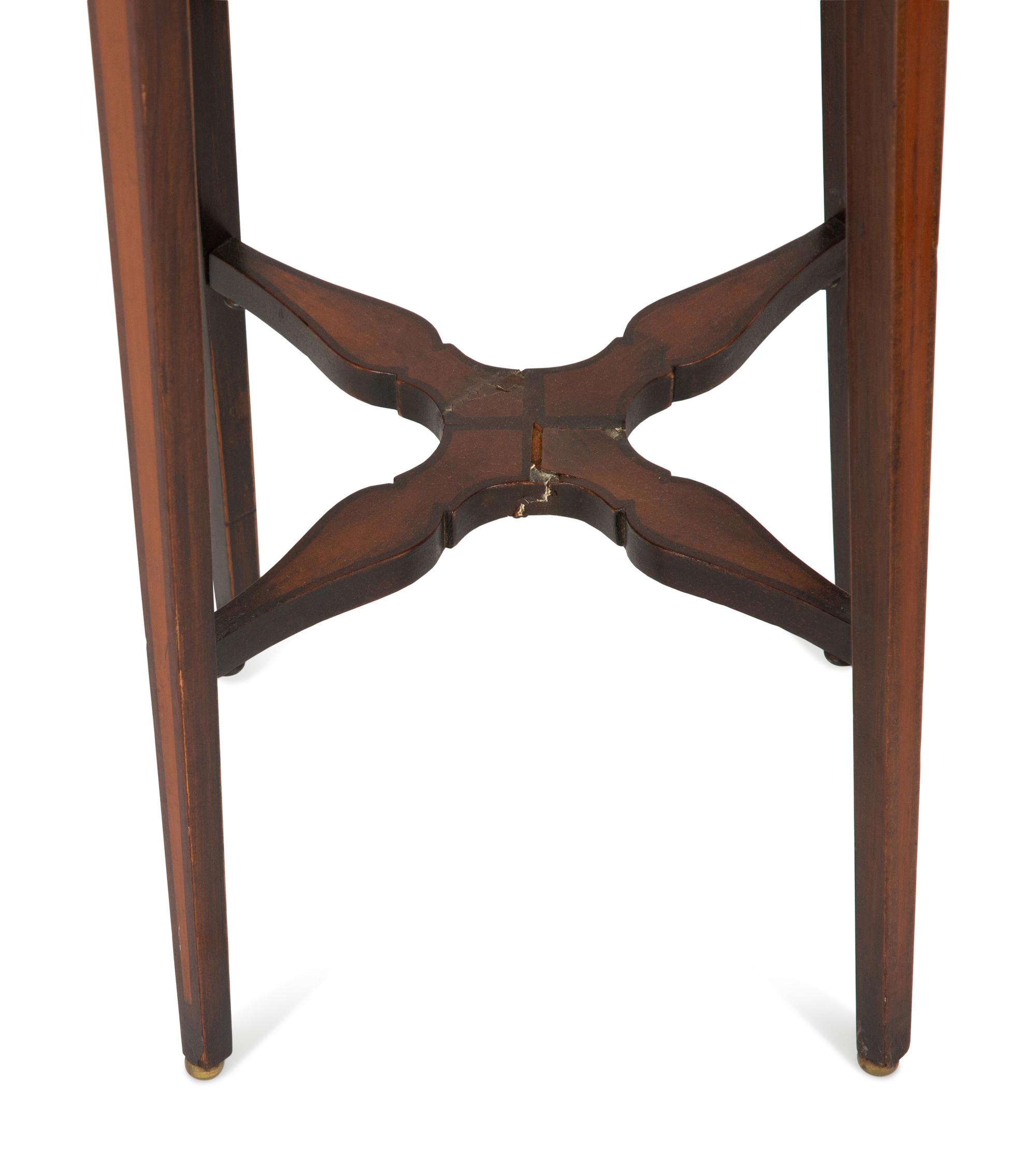 A Pair of George III Style Mahogany Candle Stands