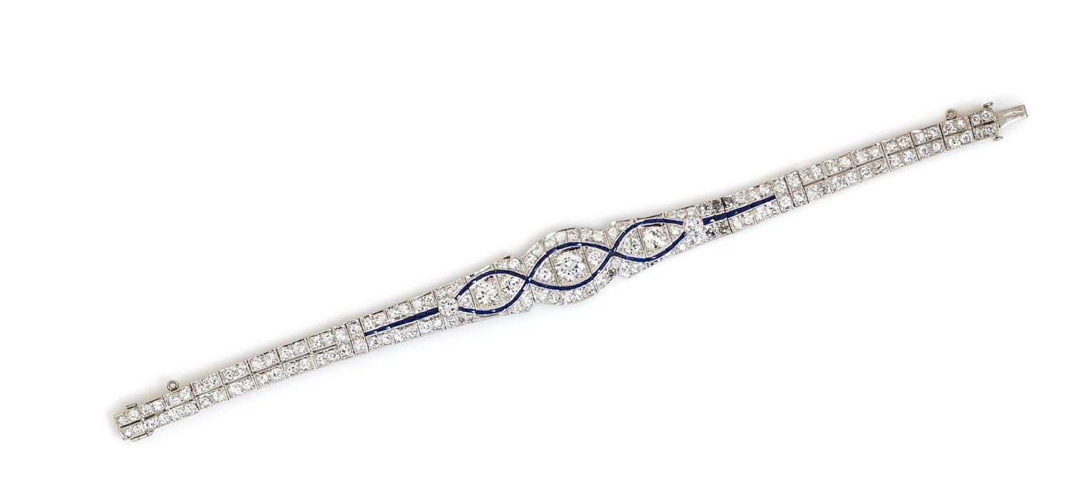 An Art Deco Platinum, Diamond, and Synthetic Sapphire Bracelet, 12.40 dwts.