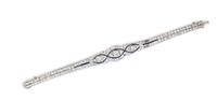 An Art Deco Platinum, Diamond, and Synthetic Sapphire Bracelet, 12.40 dwts.