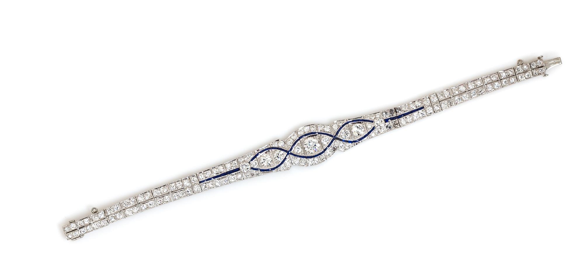 An Art Deco Platinum, Diamond, and Synthetic Sapphire Bracelet, 12.40 dwts.