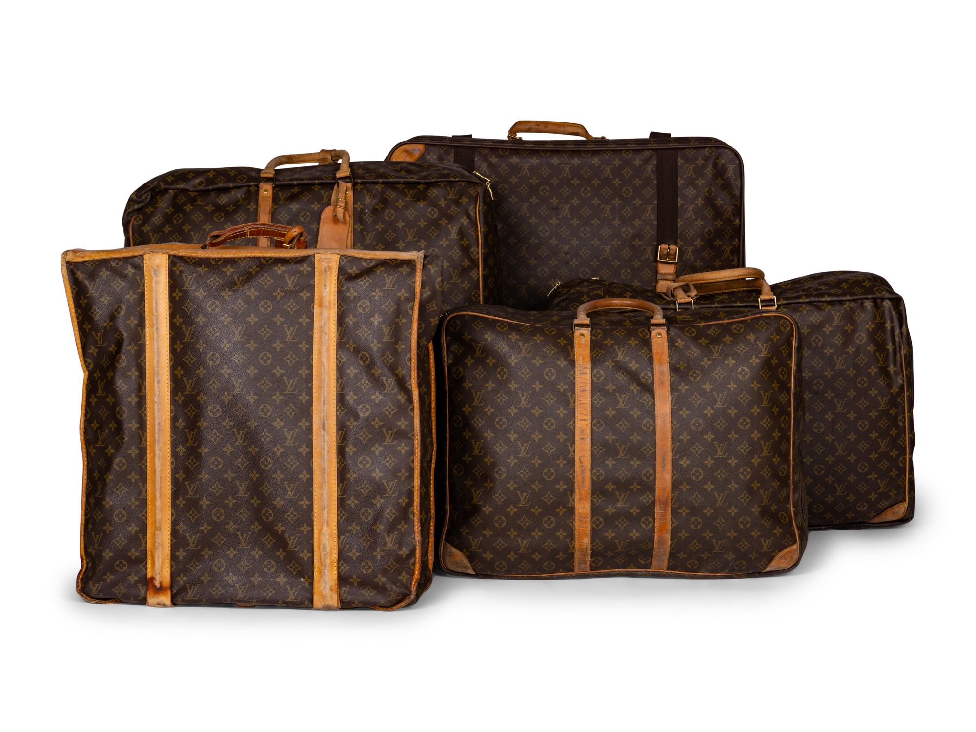 A Group of Five Louis Vuitton Travel Articles