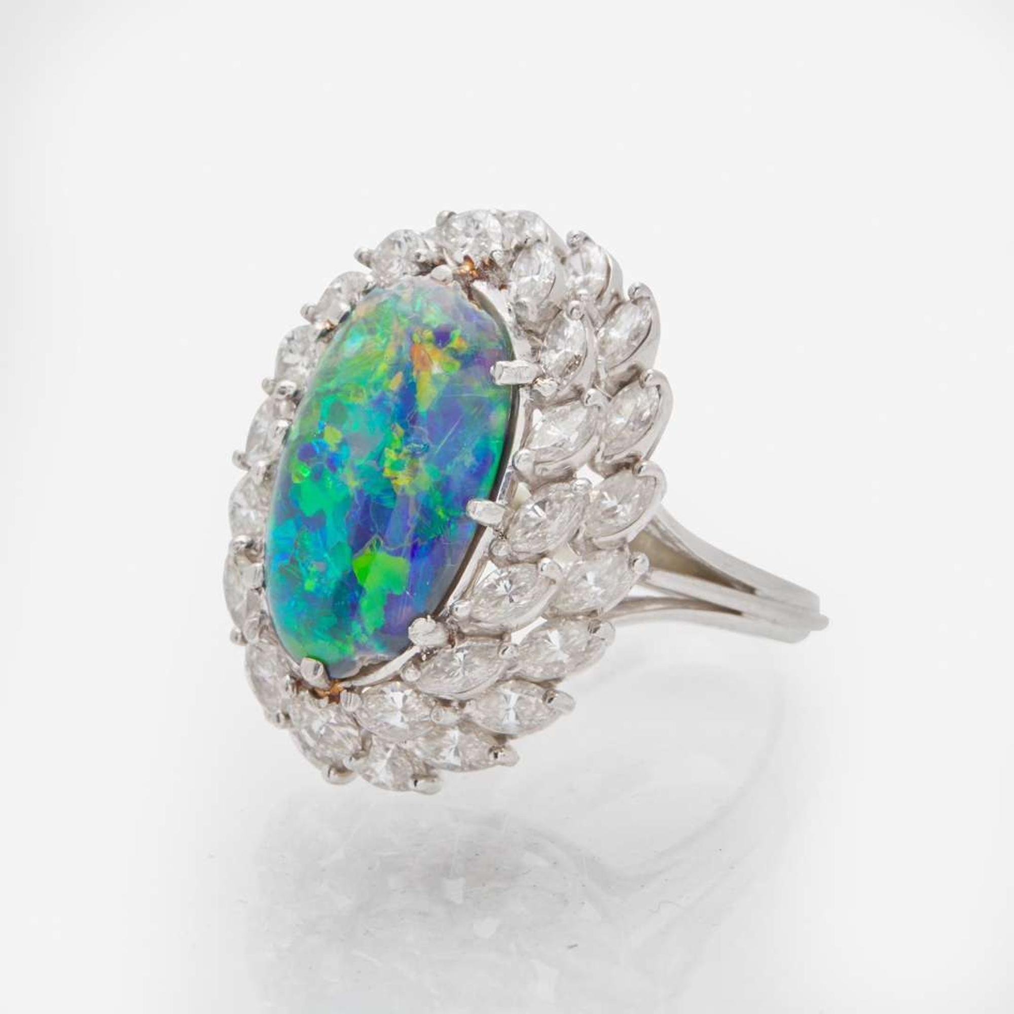 A Platinum, Black Opal, and Diamond Ring