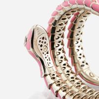 An enamel, white gold plated sterling silver, diamond, and ruby bangle
