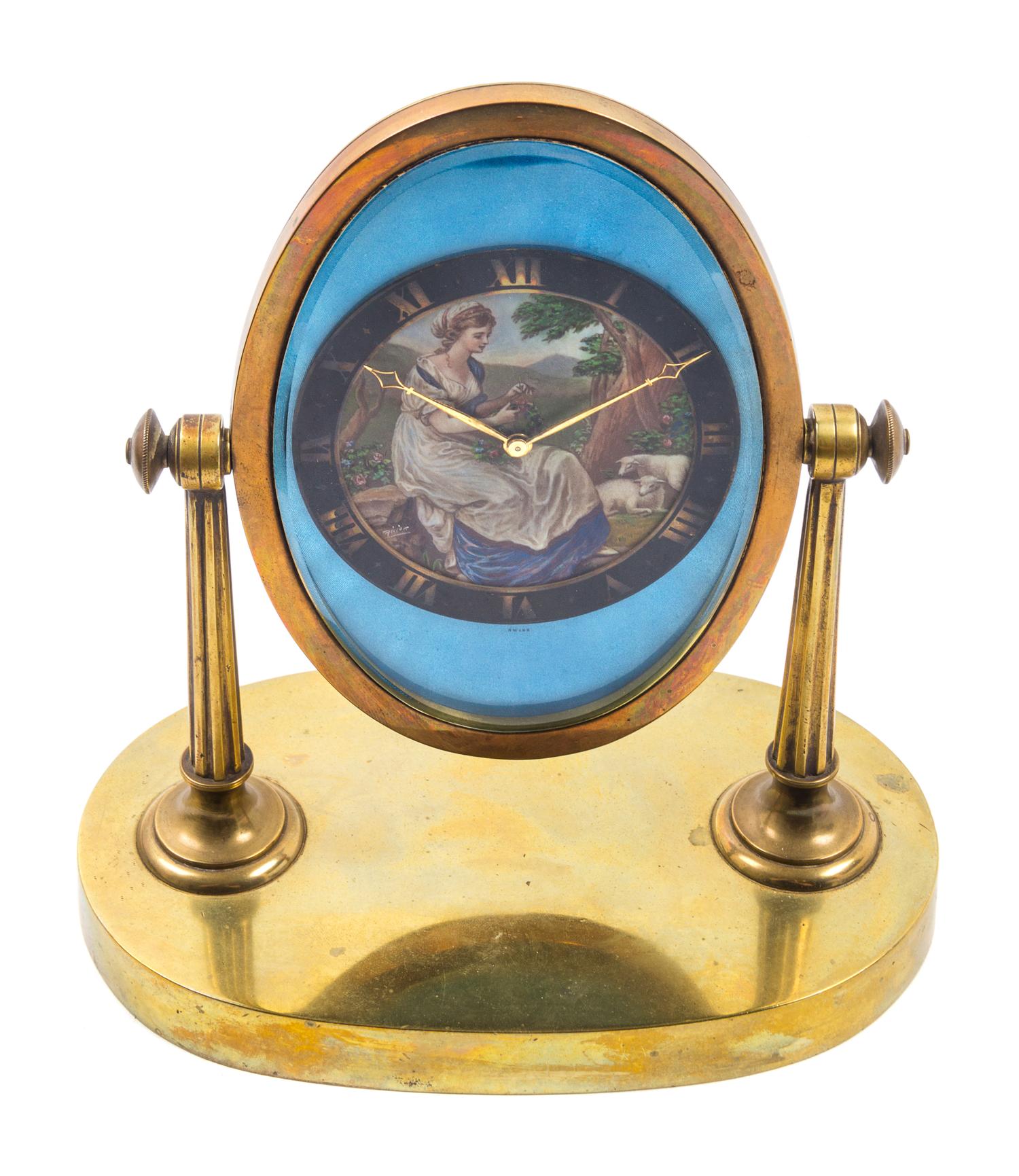 A Swiss Brass Desk Clock Height 7 3/4 inches. — GUBELIN, LUCERNE, EARLY 20TH CENTURY