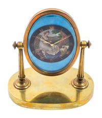 A Swiss Brass Desk Clock Height 7 3/4 inches. — GUBELIN, LUCERNE, EARLY 20TH CENTURY