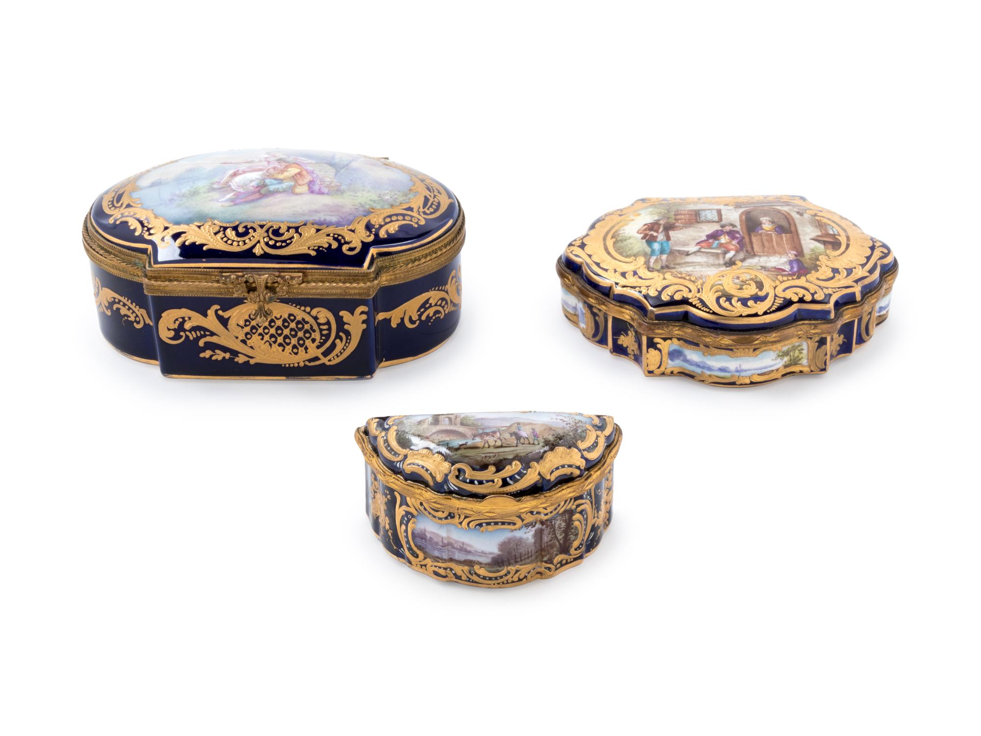 Three Sèvres Style Gilt Metal Mounted Painted and Parcel Gilt Porcelain Boxes