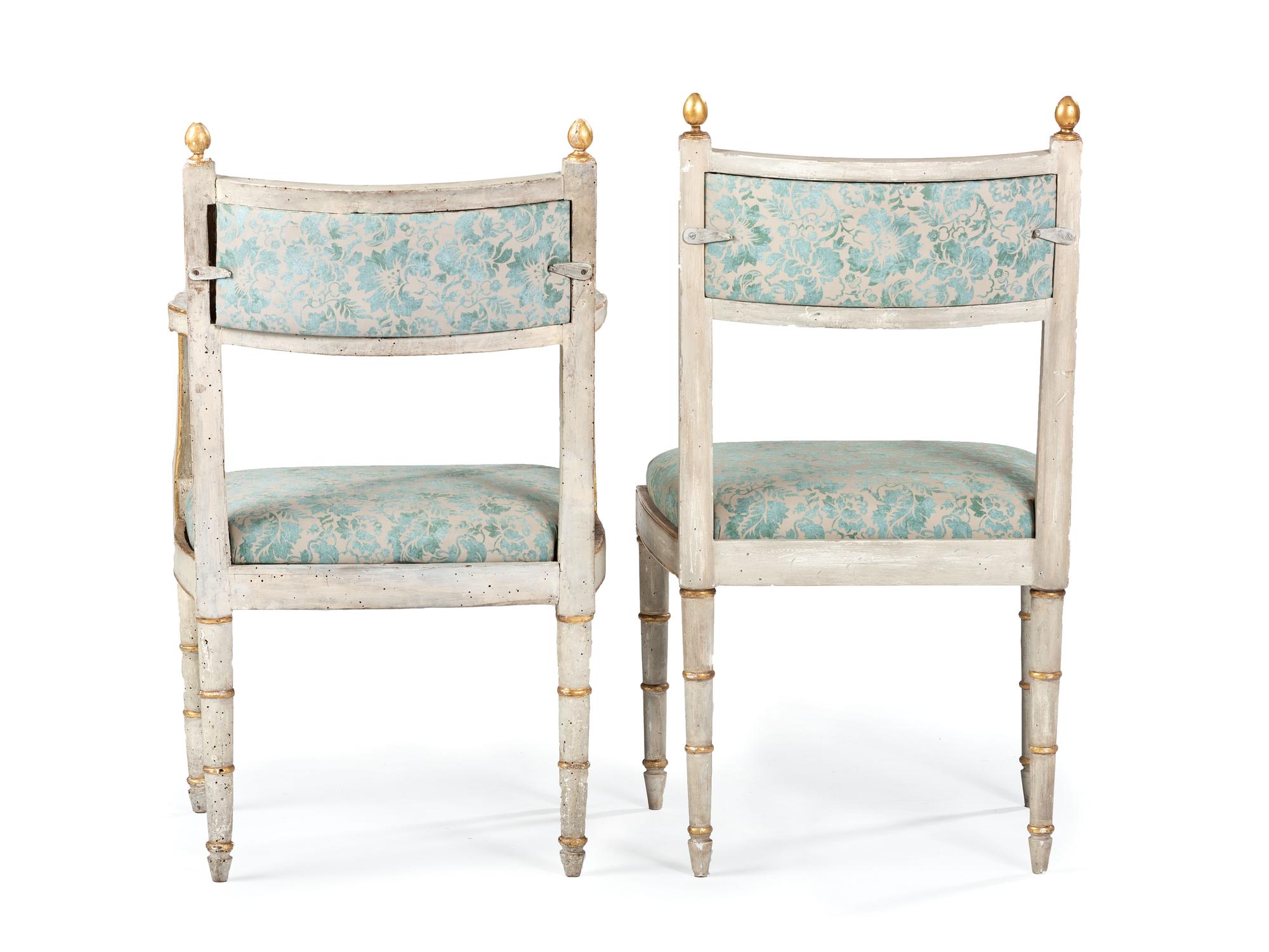A Set of Ten Italian Painted and Parcel Gilt Dining Chairs with Fortuny Upholstery