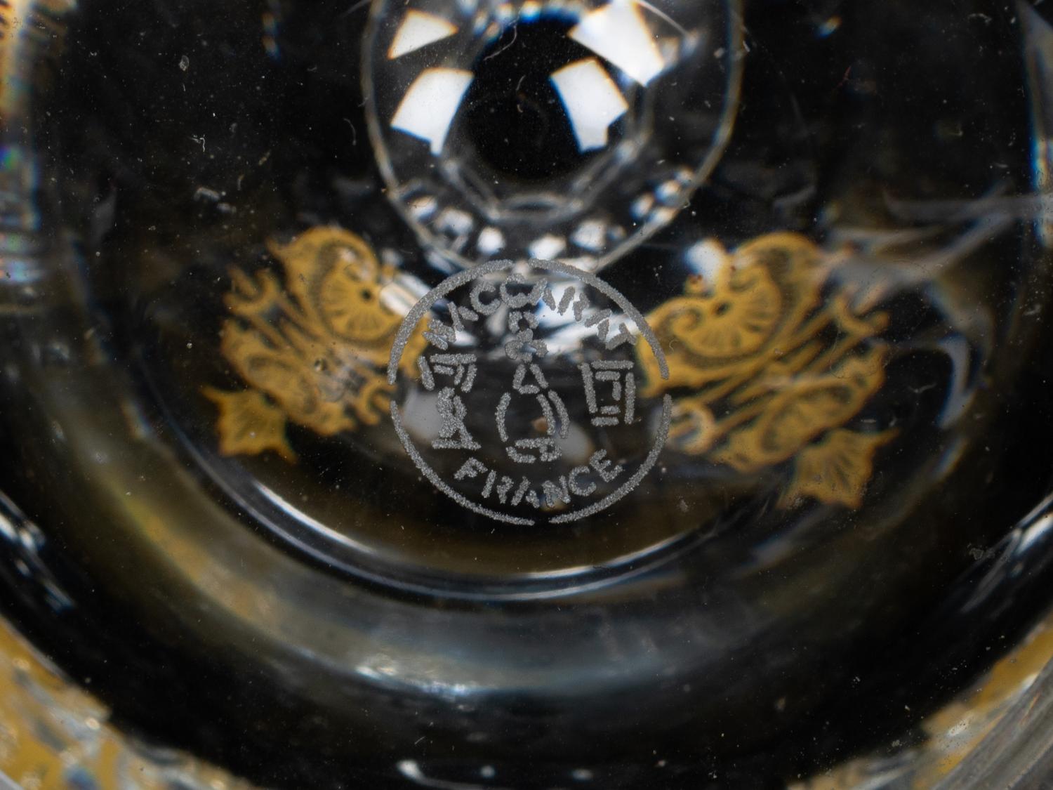 A Set of Three Baccarat Glass Decanters with Gilt Decoration