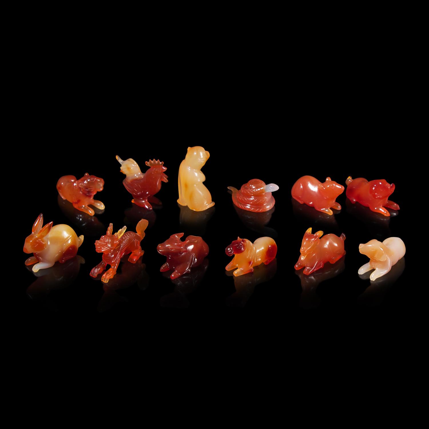 A Set of 12 Chinese Carved Agate Zodiac Figures, 20th Century 近代 瑪瑙雕生肖把件一組十二件