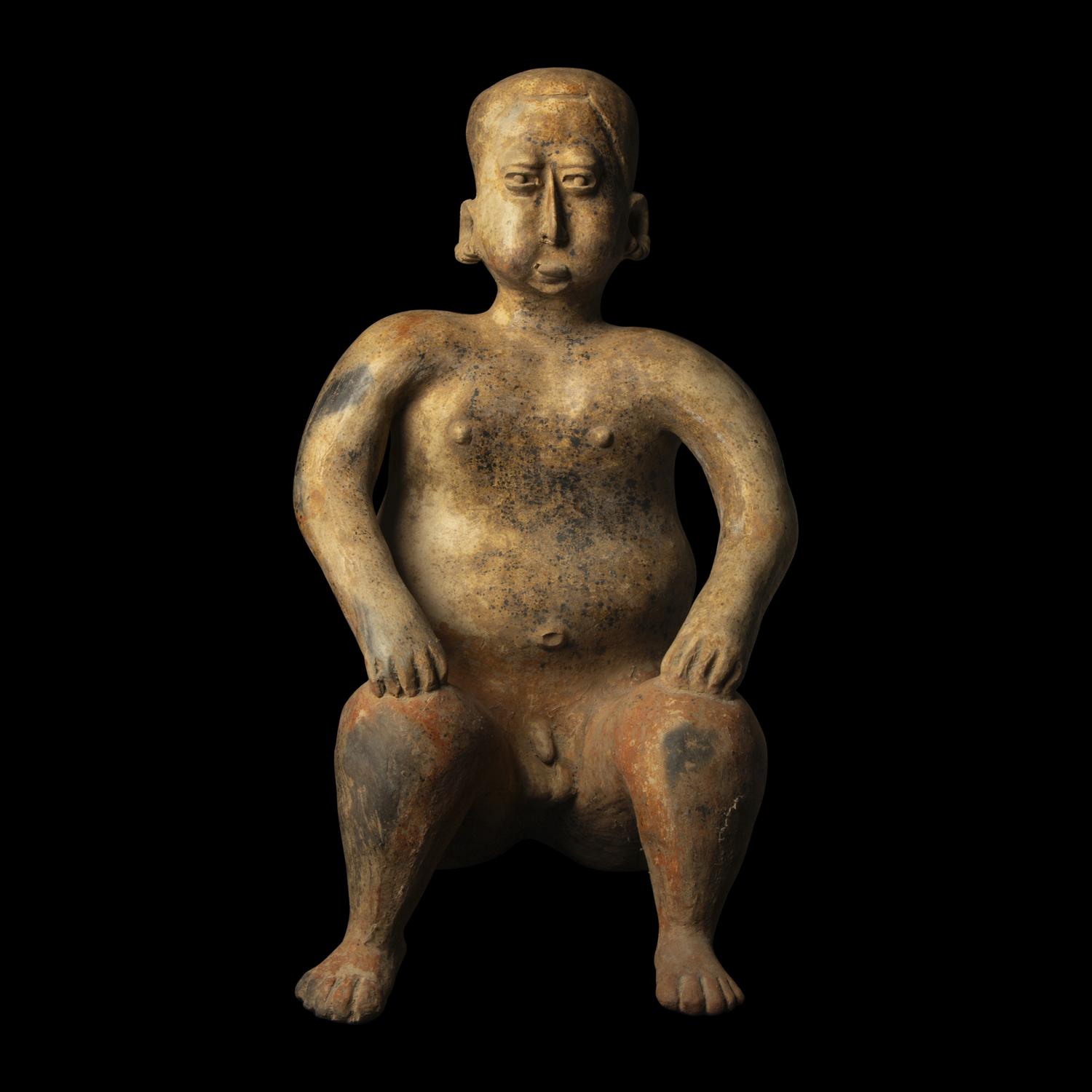 A Jalisco Terracotta Seated Male Figure