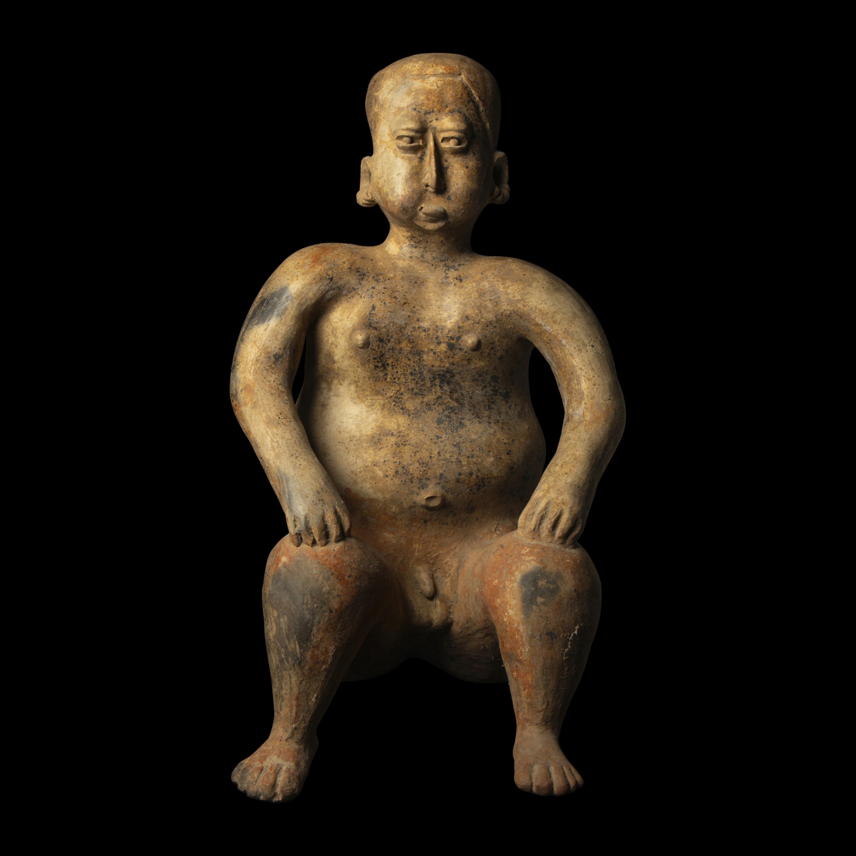 A Jalisco Terracotta Seated Male Figure