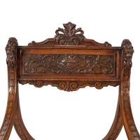 A Pair of Italian Carved Walnut Savonarola Chairs