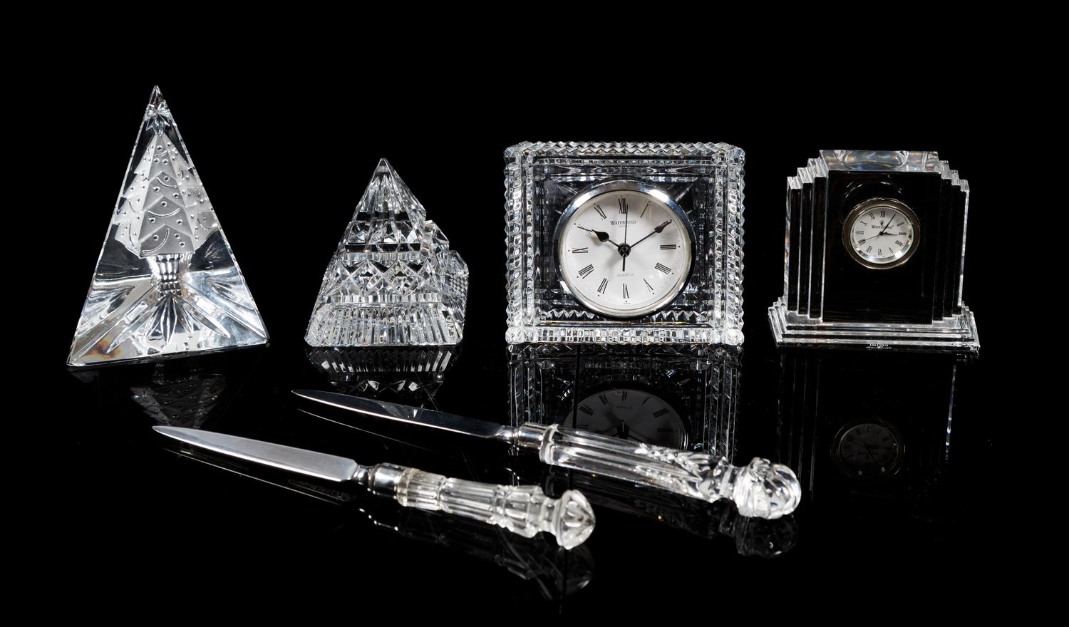 Waterford, a group of six crystal table articles, comprising two clocks, two paperweights and two letter openers
