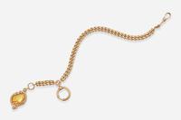 A 14K Yellow Gold Russian Pocket Watch Chain and Locket