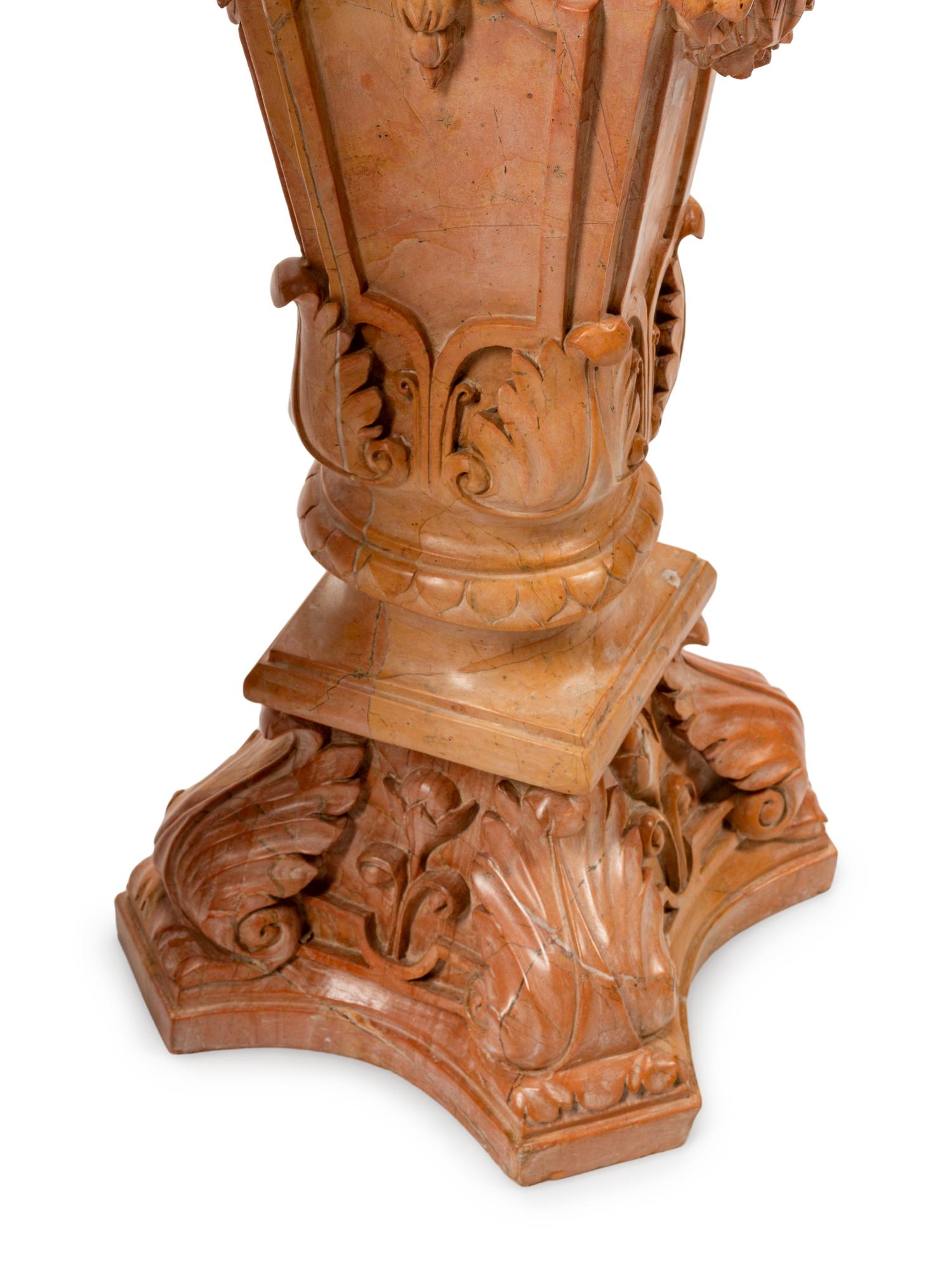 A Pair of Carved Marble Figural Pedestals