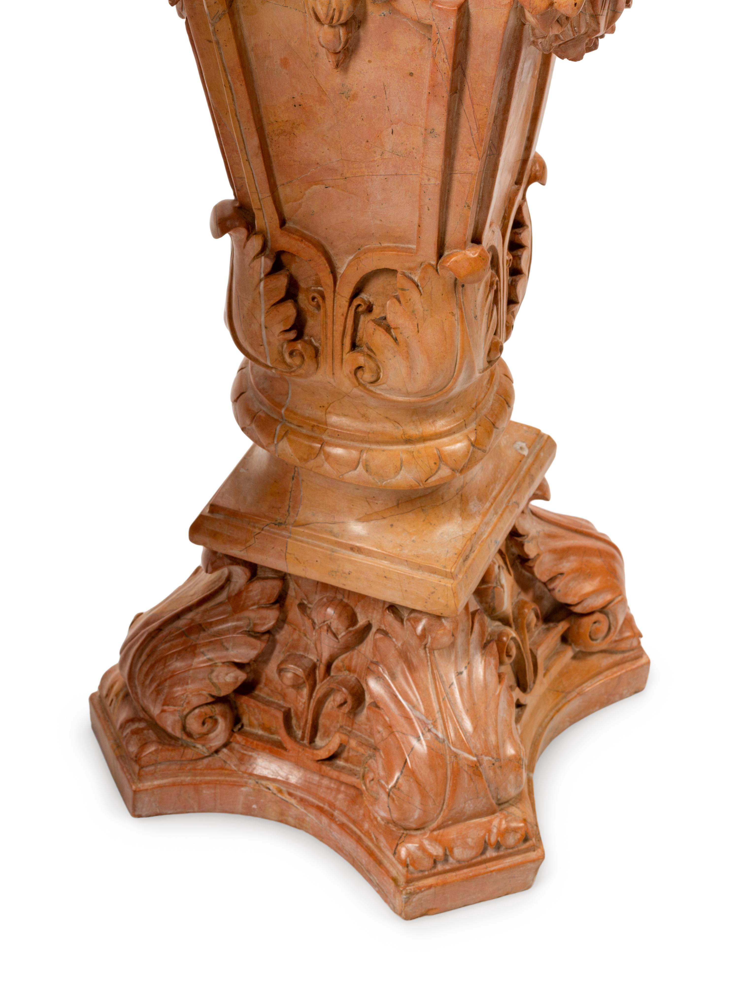 A Pair of Carved Marble Figural Pedestals