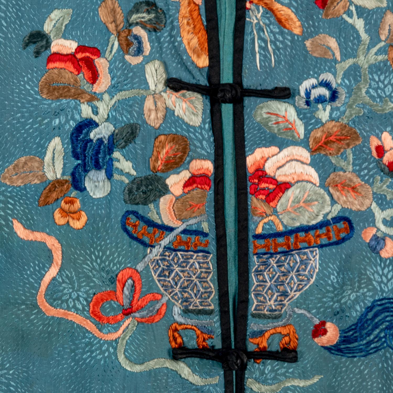 A Chinese Celeste Blue Ground Embroidered Silk Lady's Jacket 清晚期 藍地牡丹花籃紋褂