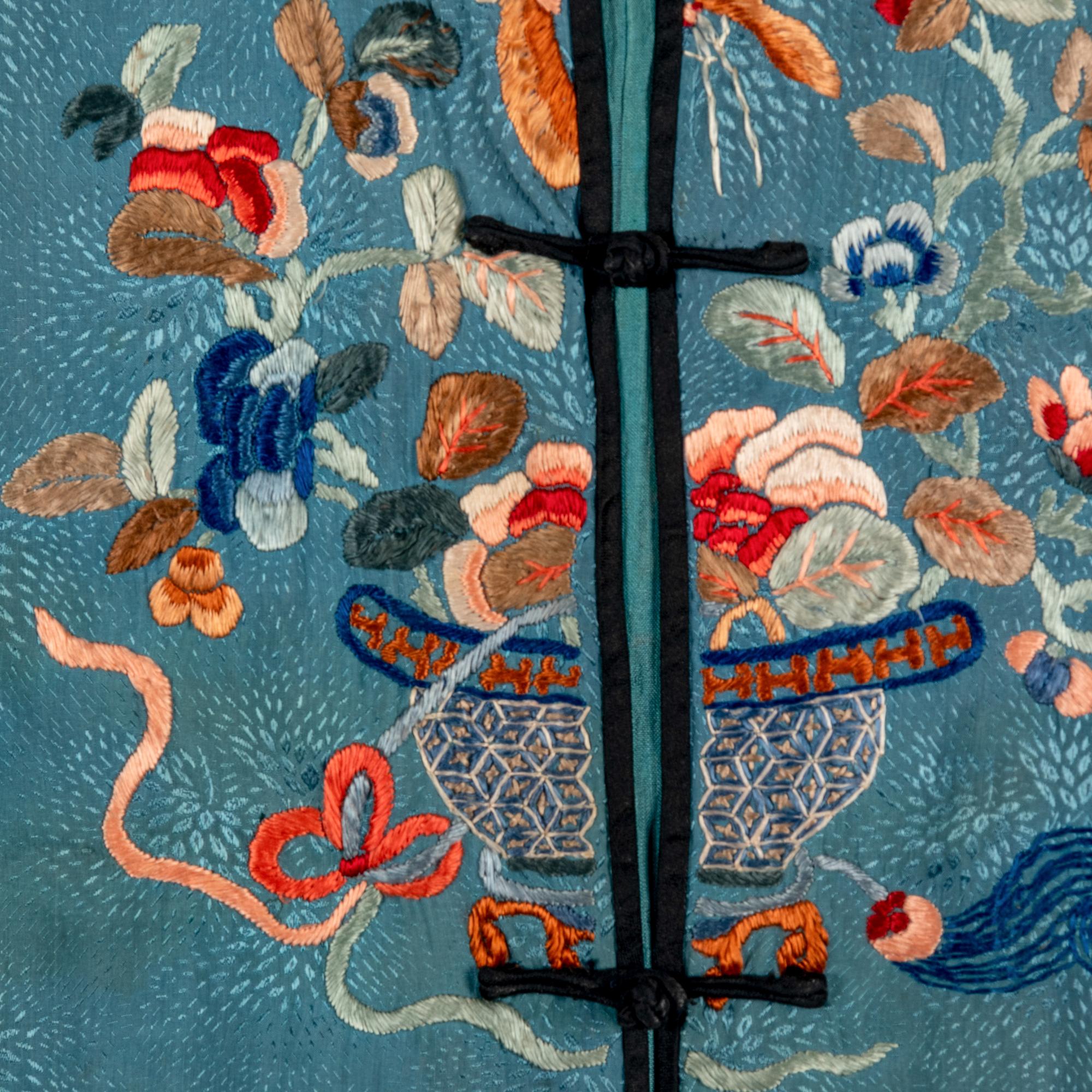 A Chinese Celeste Blue Ground Embroidered Silk Lady's Jacket 清晚期 藍地牡丹花籃紋褂