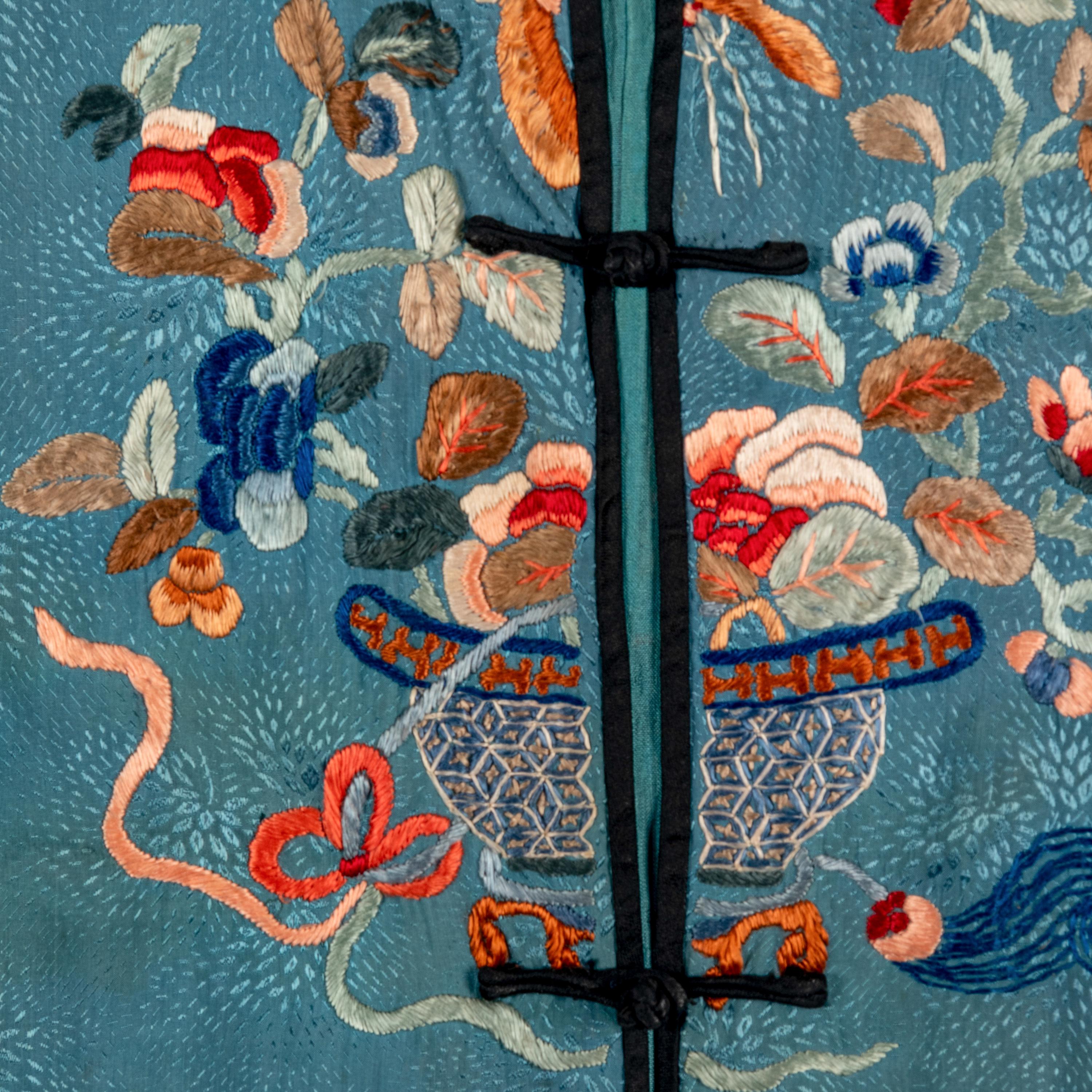 A Chinese Celeste Blue Ground Embroidered Silk Lady's Jacket 清晚期 藍地牡丹花籃紋褂