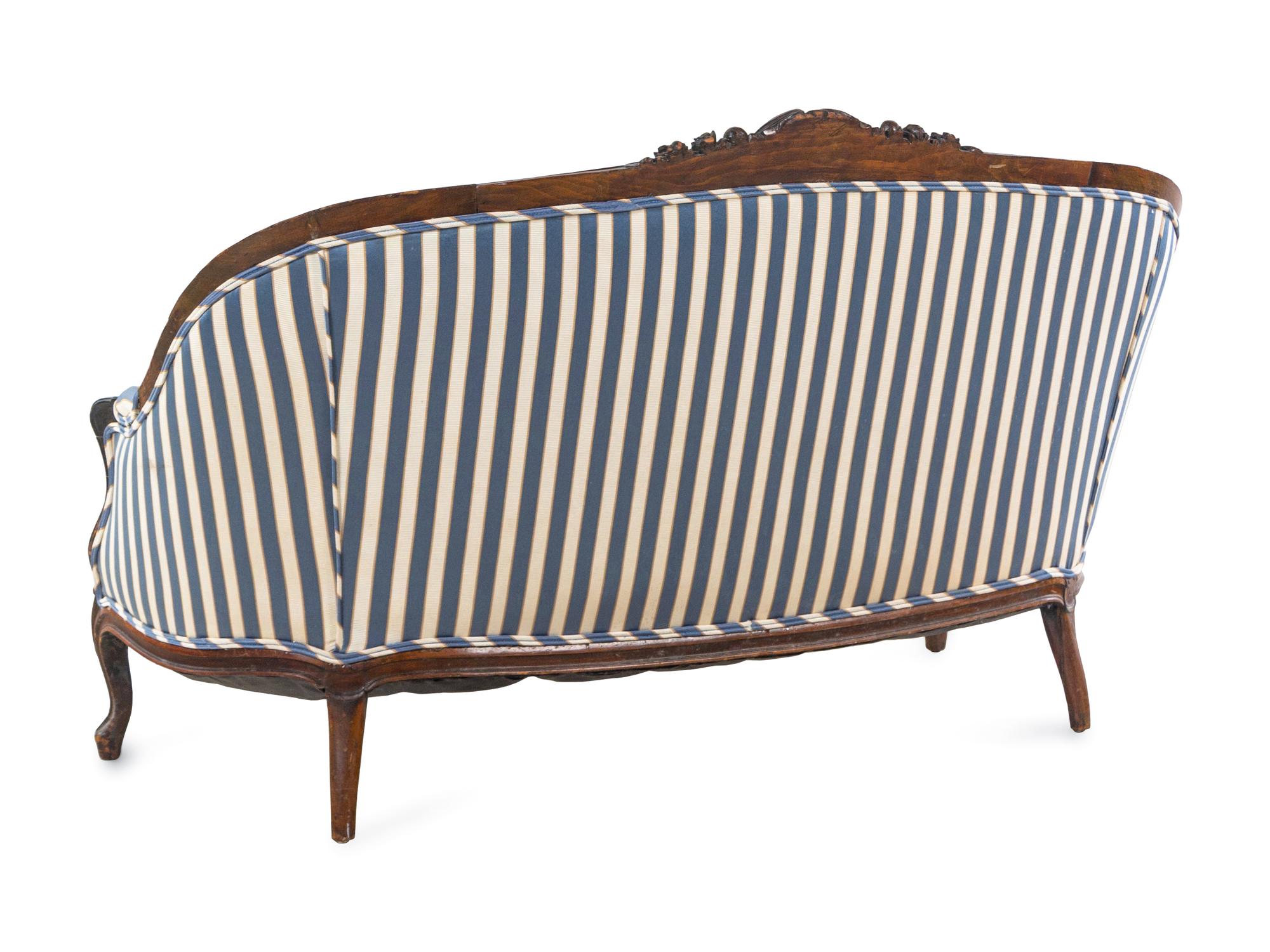 A Louis XV Style Carved Walnut Settee