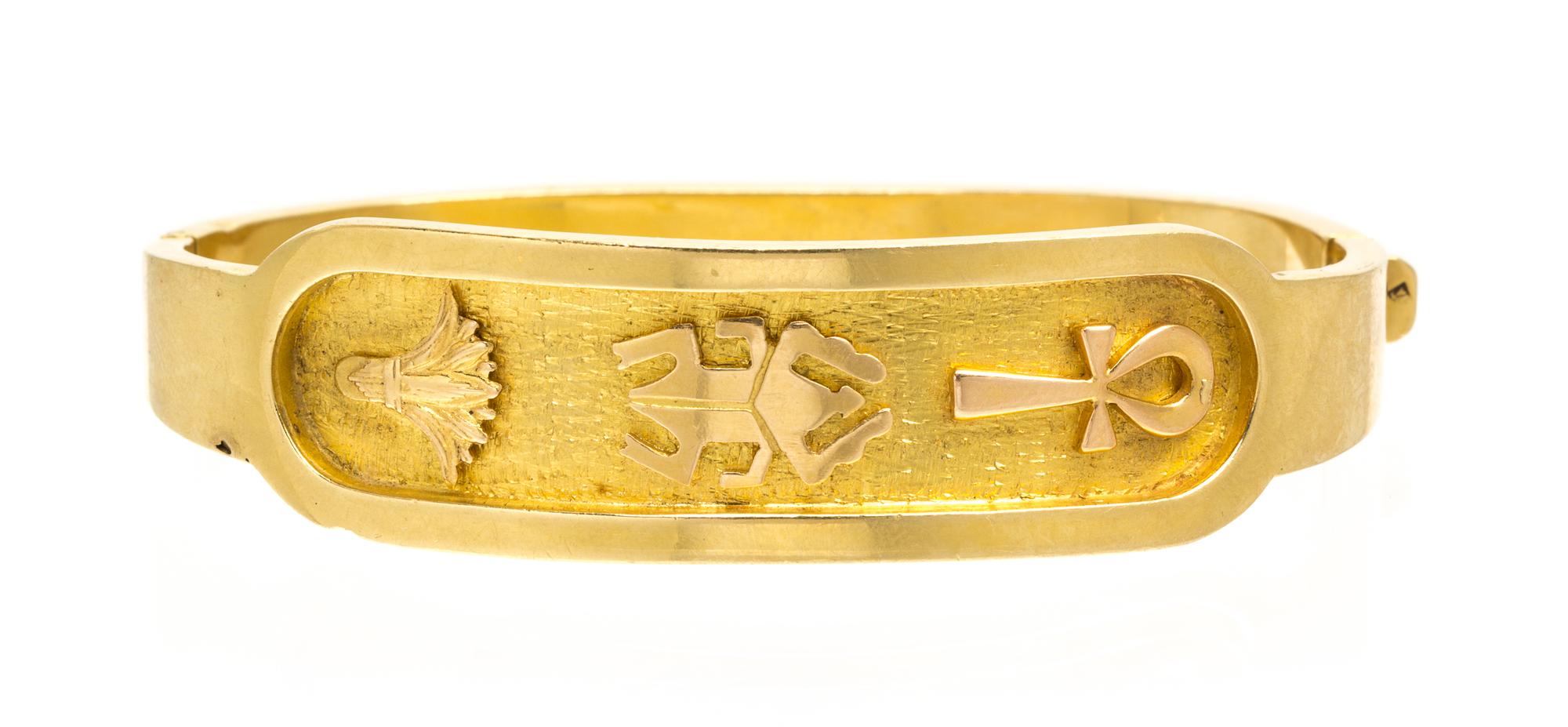 An 18 Karat Yellow Gold Egyptian Motif Bangle Bracelet, 15.60 dwts.