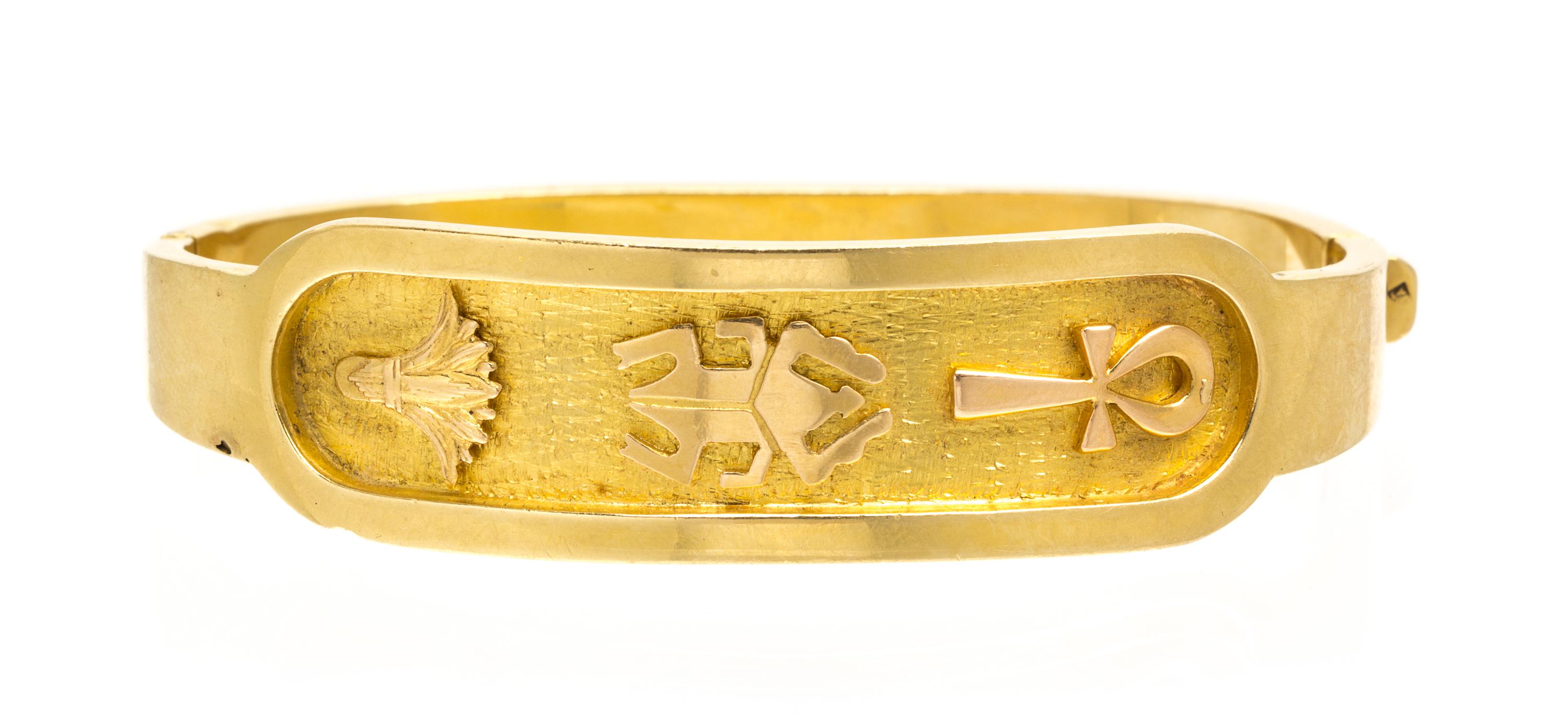 An 18 Karat Yellow Gold Egyptian Motif Bangle Bracelet, 15.60 dwts.