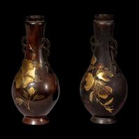 A Pair of Japanese Gilt Highlighted Bronze Handled Vases