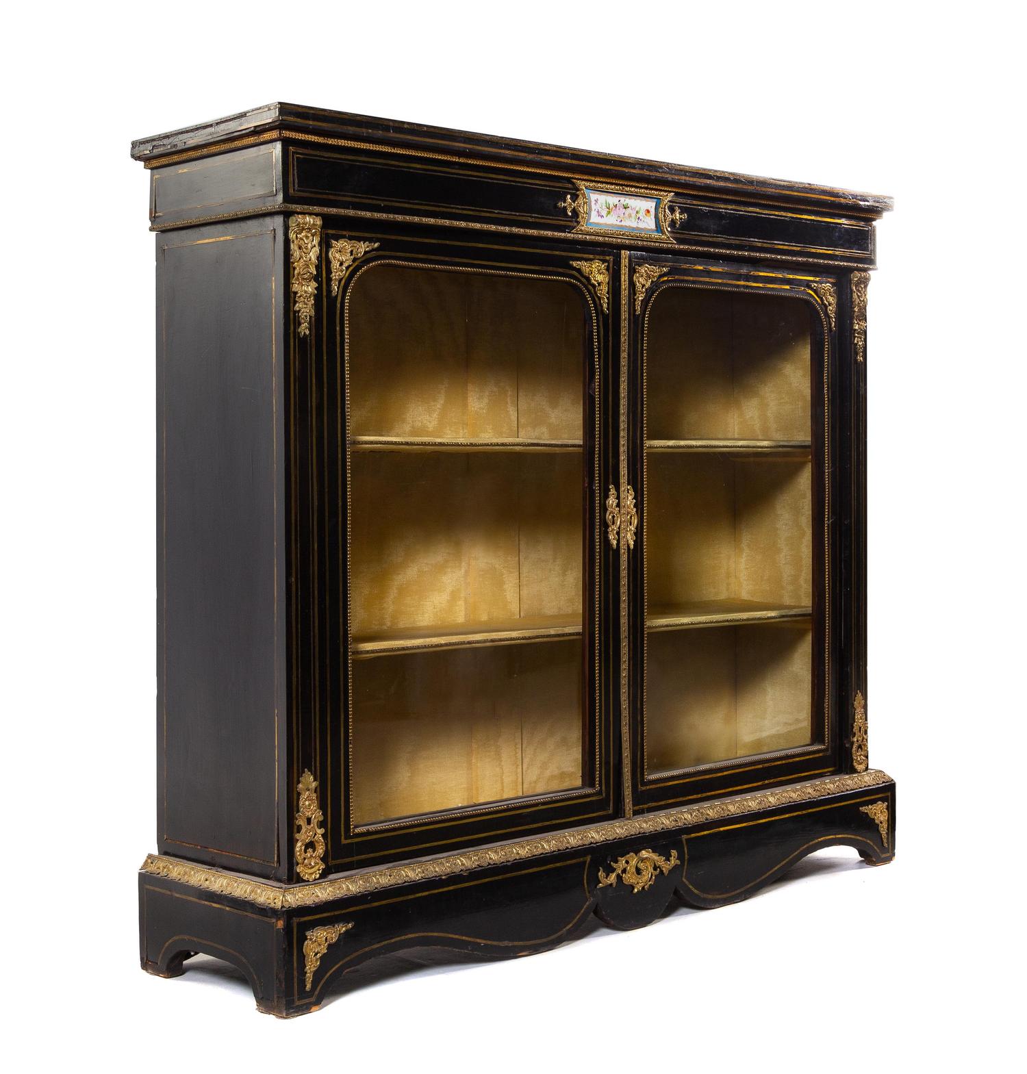 A Napoleon III Gilt Bronze Mounted and Porcelain Inset Ebonized Vitrine Cabinet