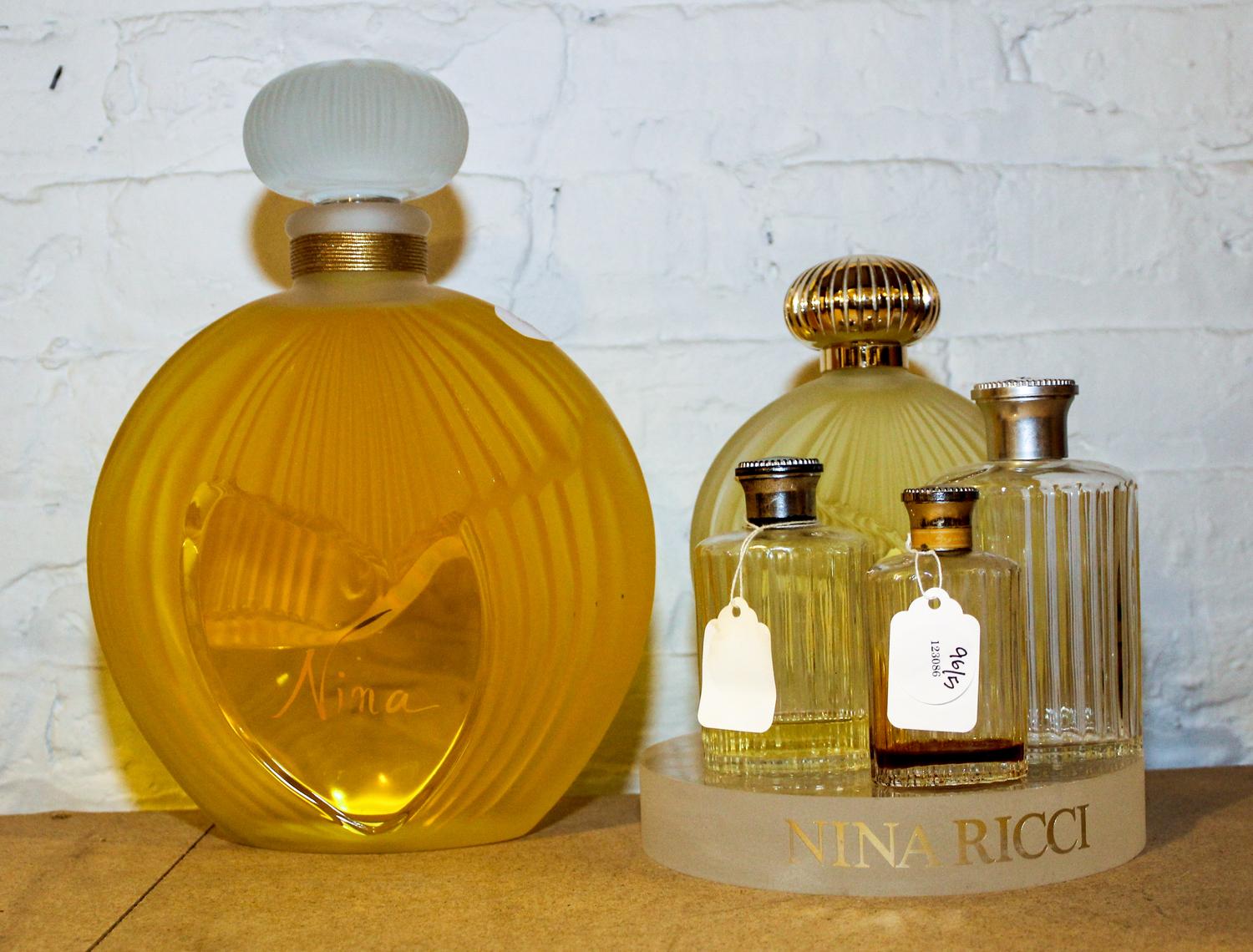 Five Lalique and Other French Glass Perfume Bottles. Height of tallest 11 1/2 inches.
