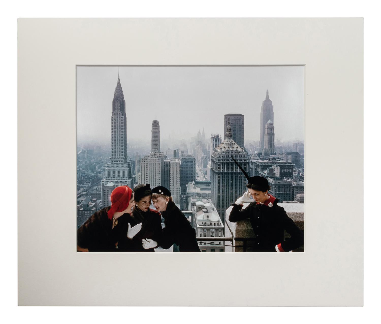 Norman Parkinson (1913-1990) Young Velvets, Young Prices, Hat Fashions, for British "Vogue" (The New York skyline from the roof of the Condé Nast building on Lexington Avenue, New York City), 1949