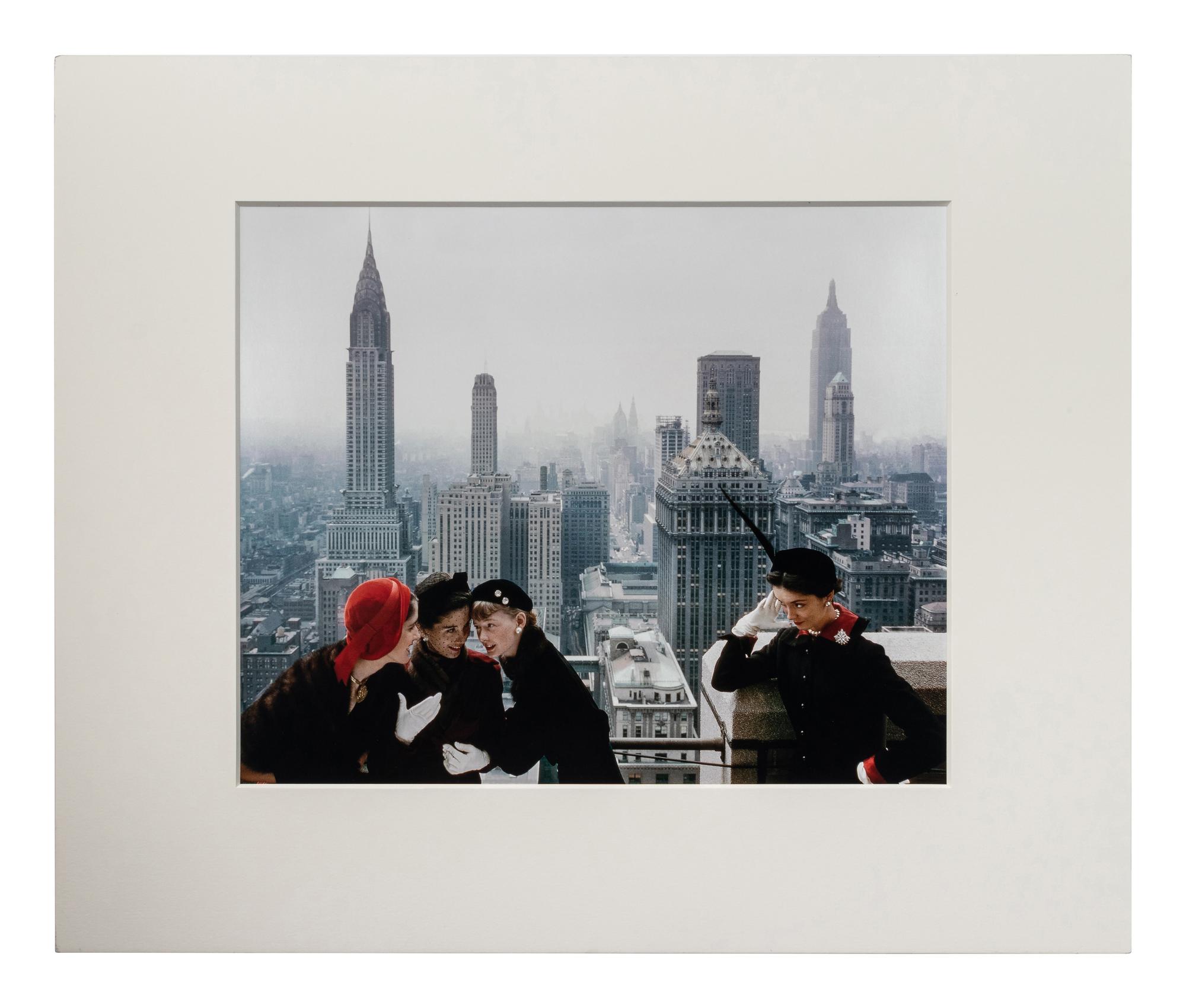 Norman Parkinson (1913-1990) Young Velvets, Young Prices, Hat Fashions, for British "Vogue" (The New York skyline from the roof of the Condé Nast building on Lexington Avenue, New York City), 1949