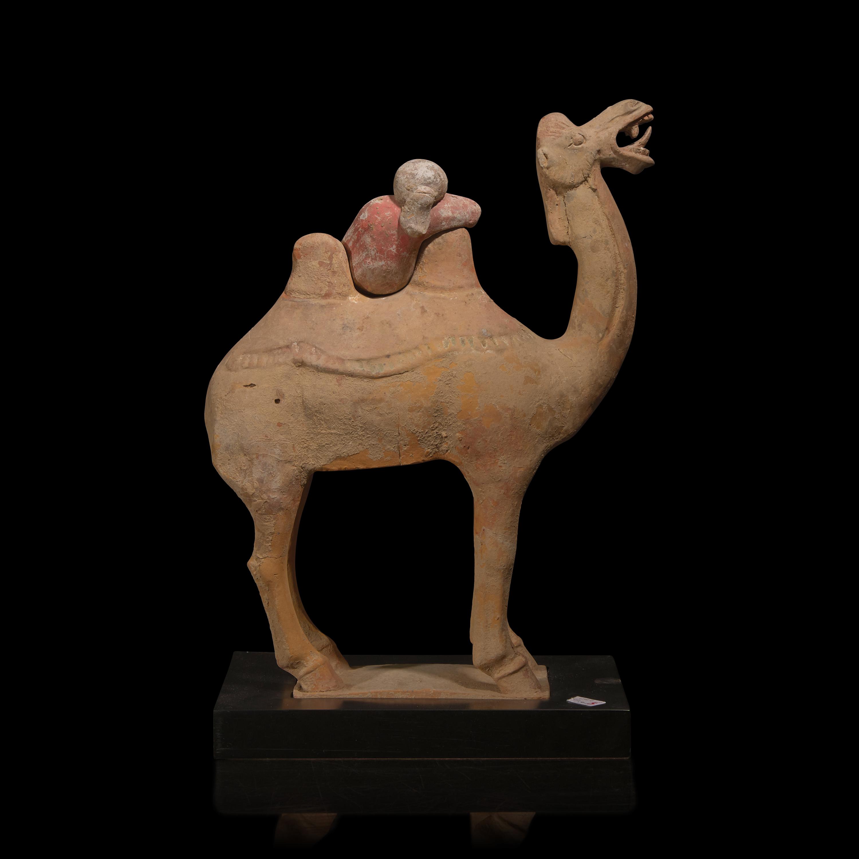 A Chinese Painted Pottery Figural Group of a Camel and a Rider, Possibly Tang Dynasty — 或為唐 陶加彩駱駝俑