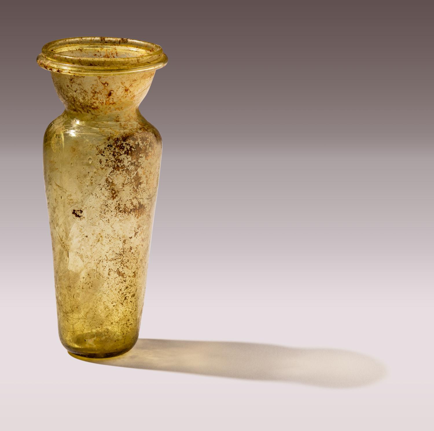 A Roman Yellow-Green Glass Amphoriskos