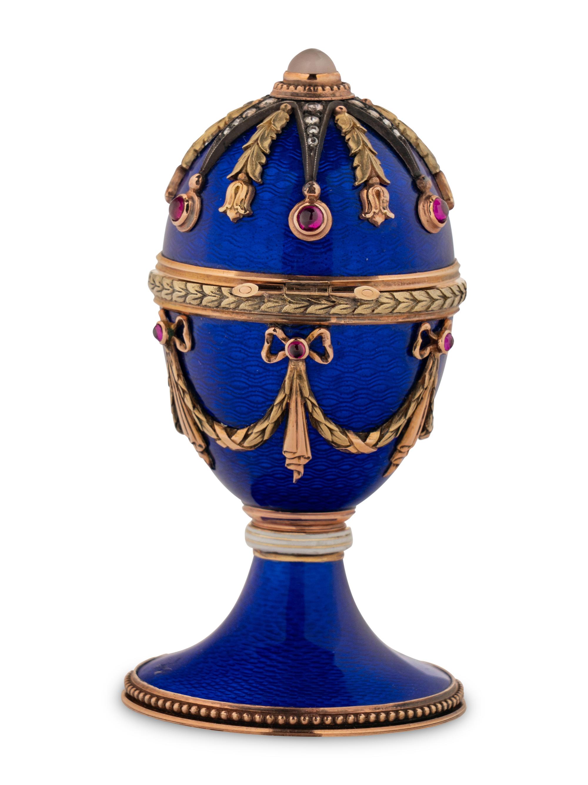 A 14 Karat Vari-Color Gold, Guilloché Enamel, Diamond, and Cabochon Jewel-Mounted Egg-Form Perfume and a Related Guilloché Enamel, 14 Karat Vari-Color Gold, Diamond, and Cabochon-Mounted Surprise Egg