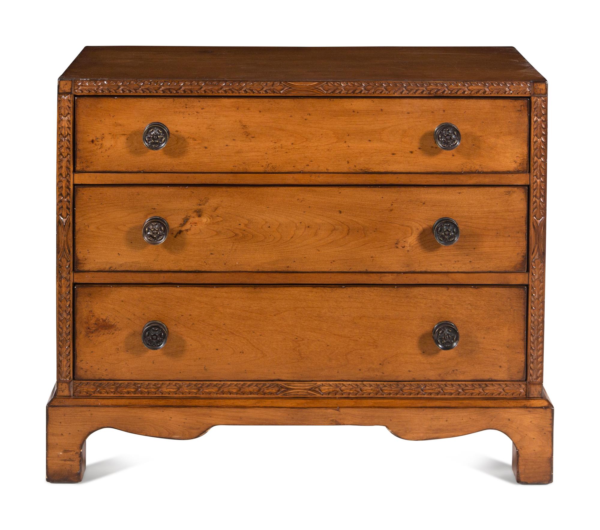 A Contemporary Carved Walnut Chest of Drawers