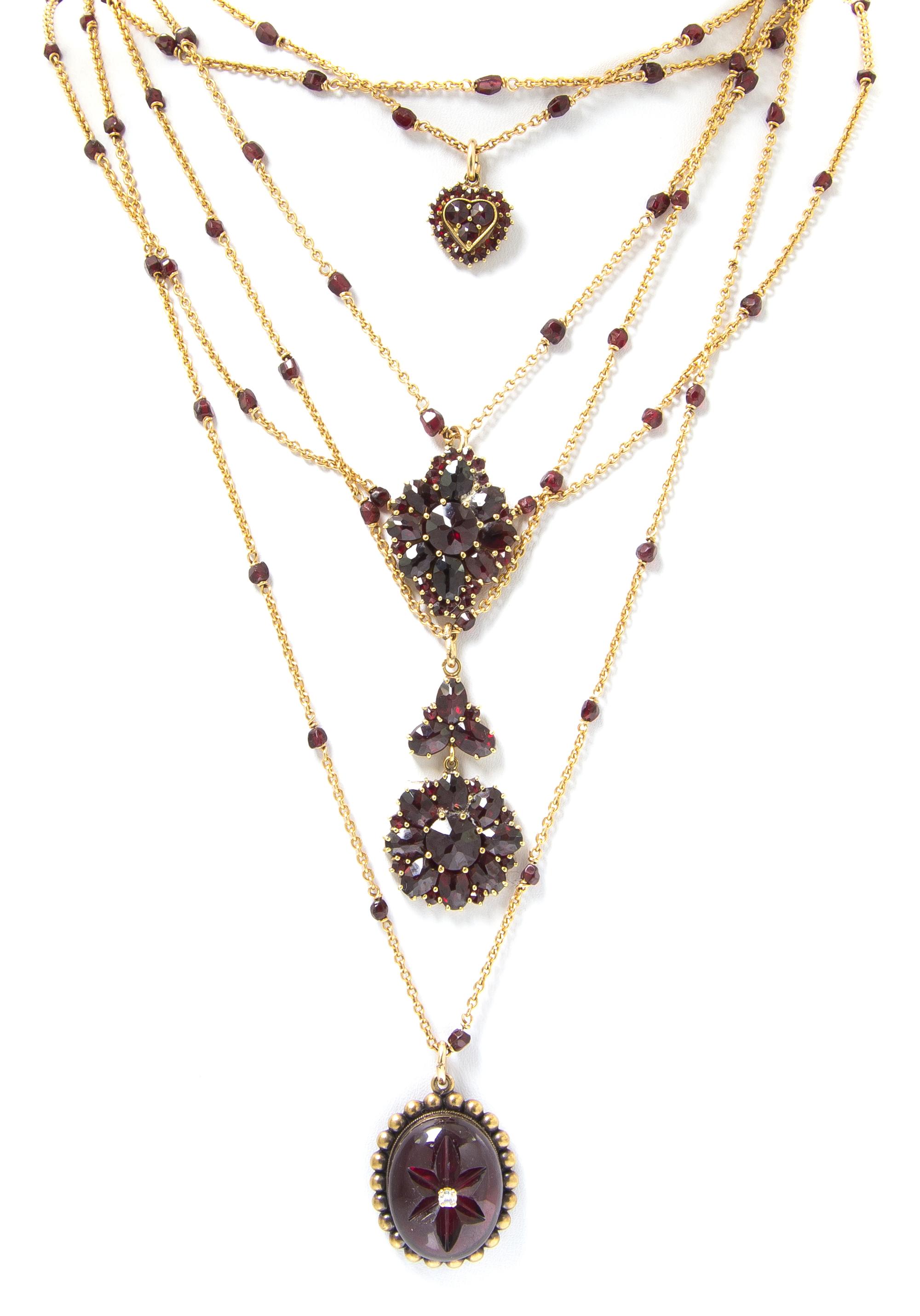 An 18 Karat Yellow Gold, Garnet and Diamond Multi Strand Necklace, French, 57.40 dwts.