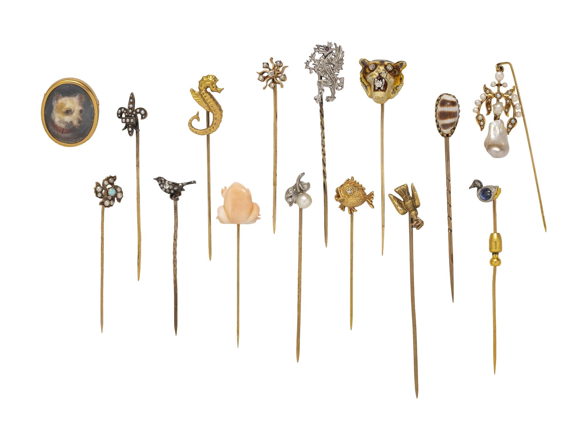 COLLECTION OF STICKPINS AND A BROOCH
