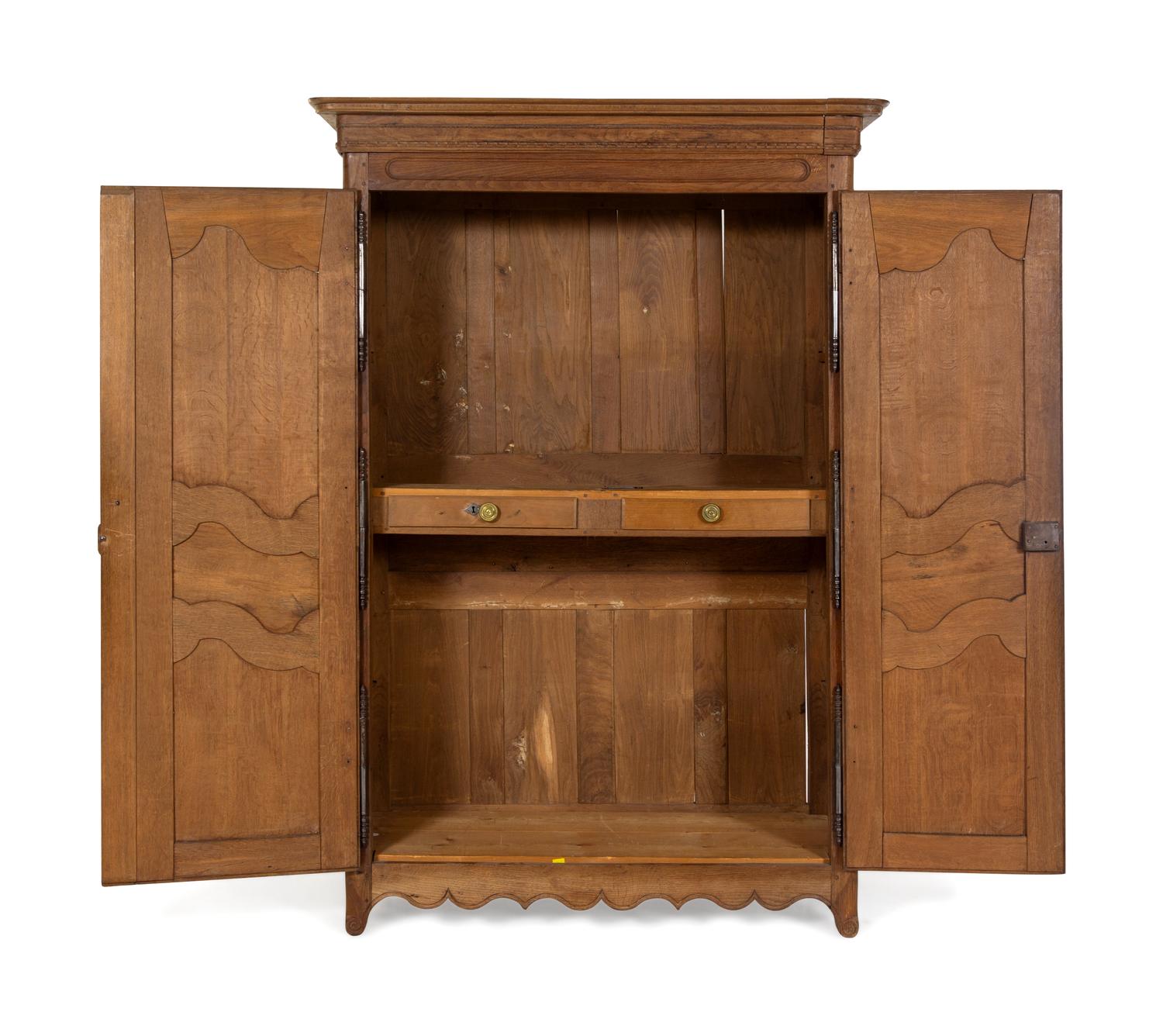 A French Provincial Carved Oak Armoire