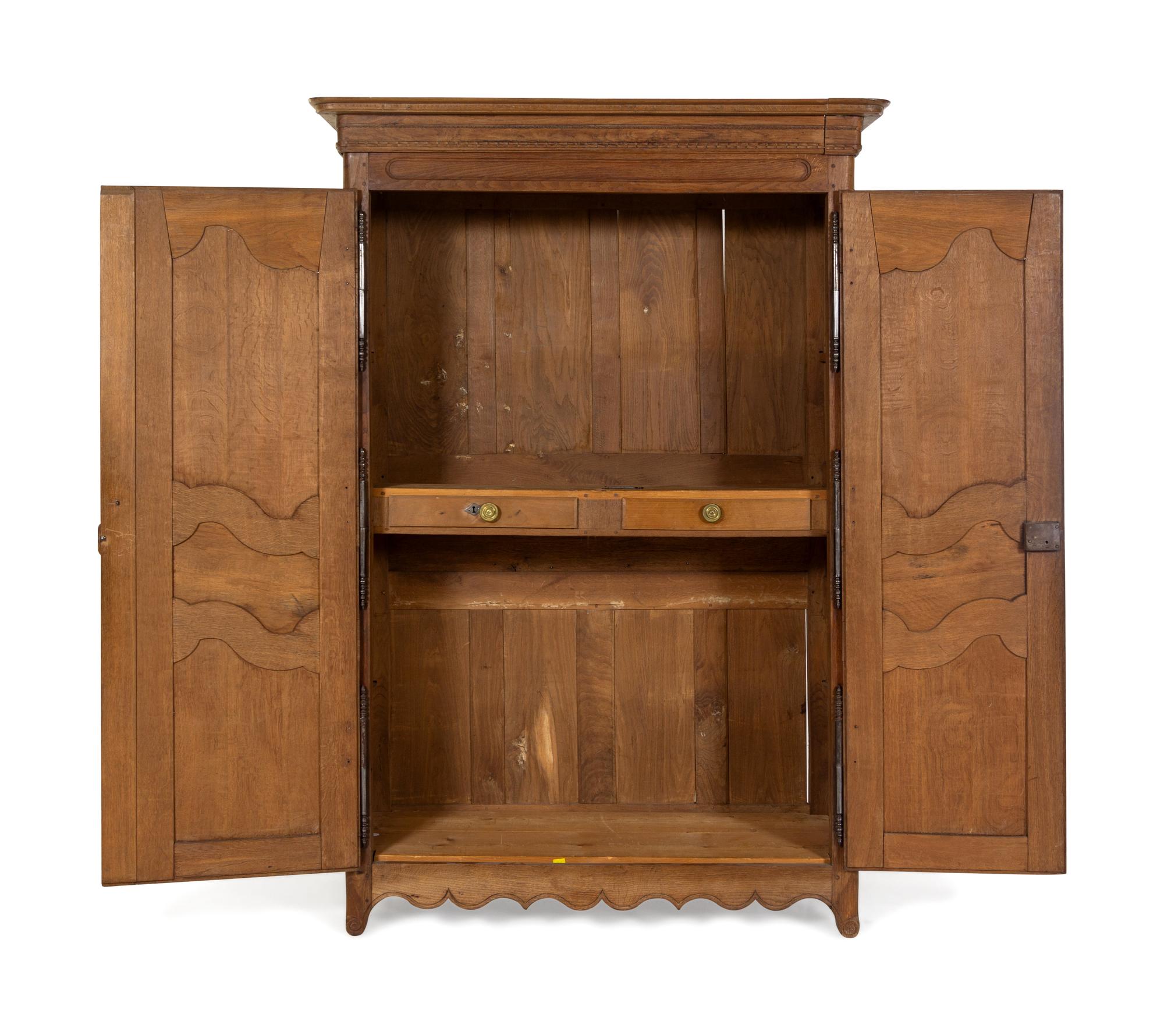 A French Provincial Carved Oak Armoire