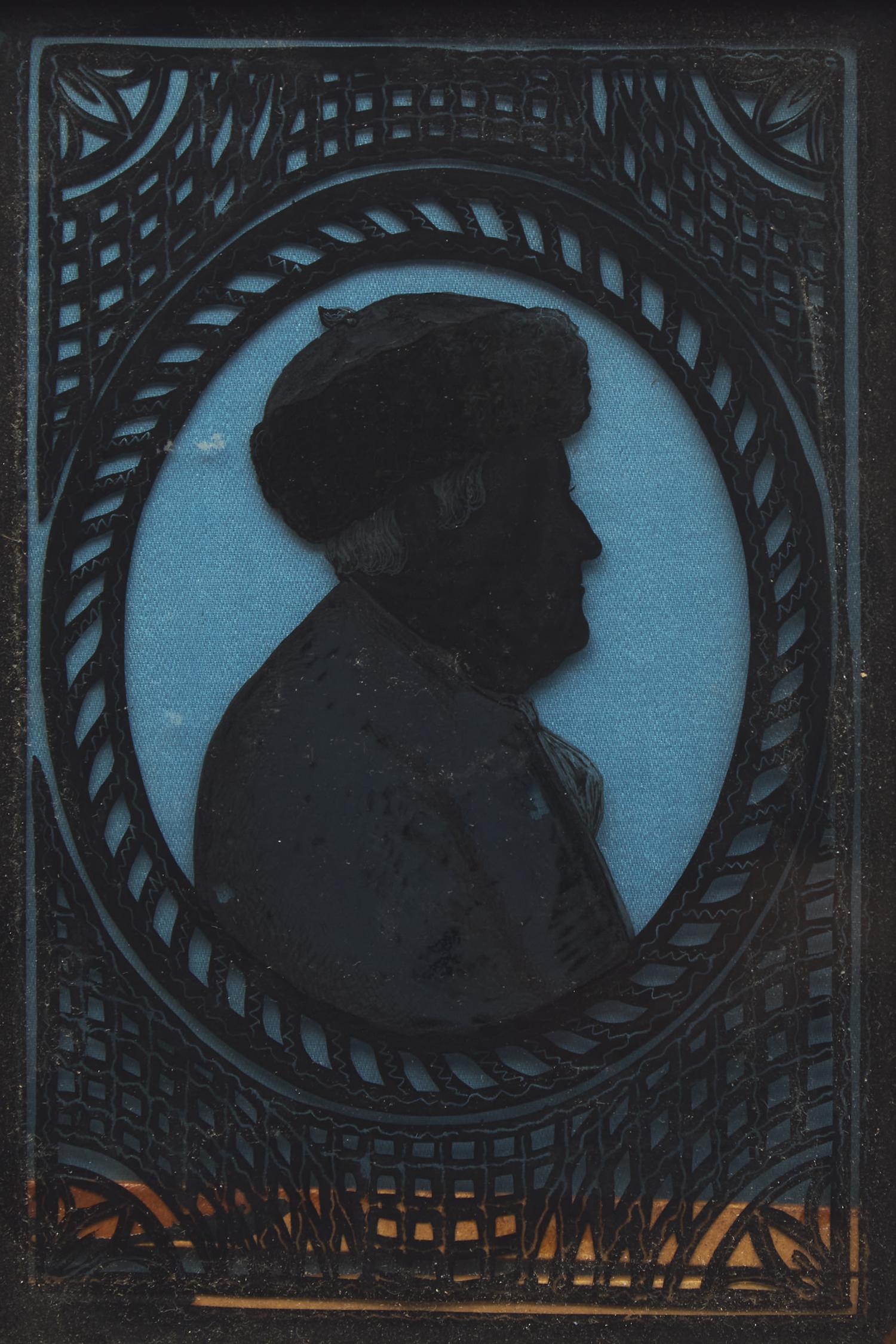 American School 19th Century, A Miniature Eglomise Silhouette Profile Portrait of Benjamin Franklin with Fur Cap