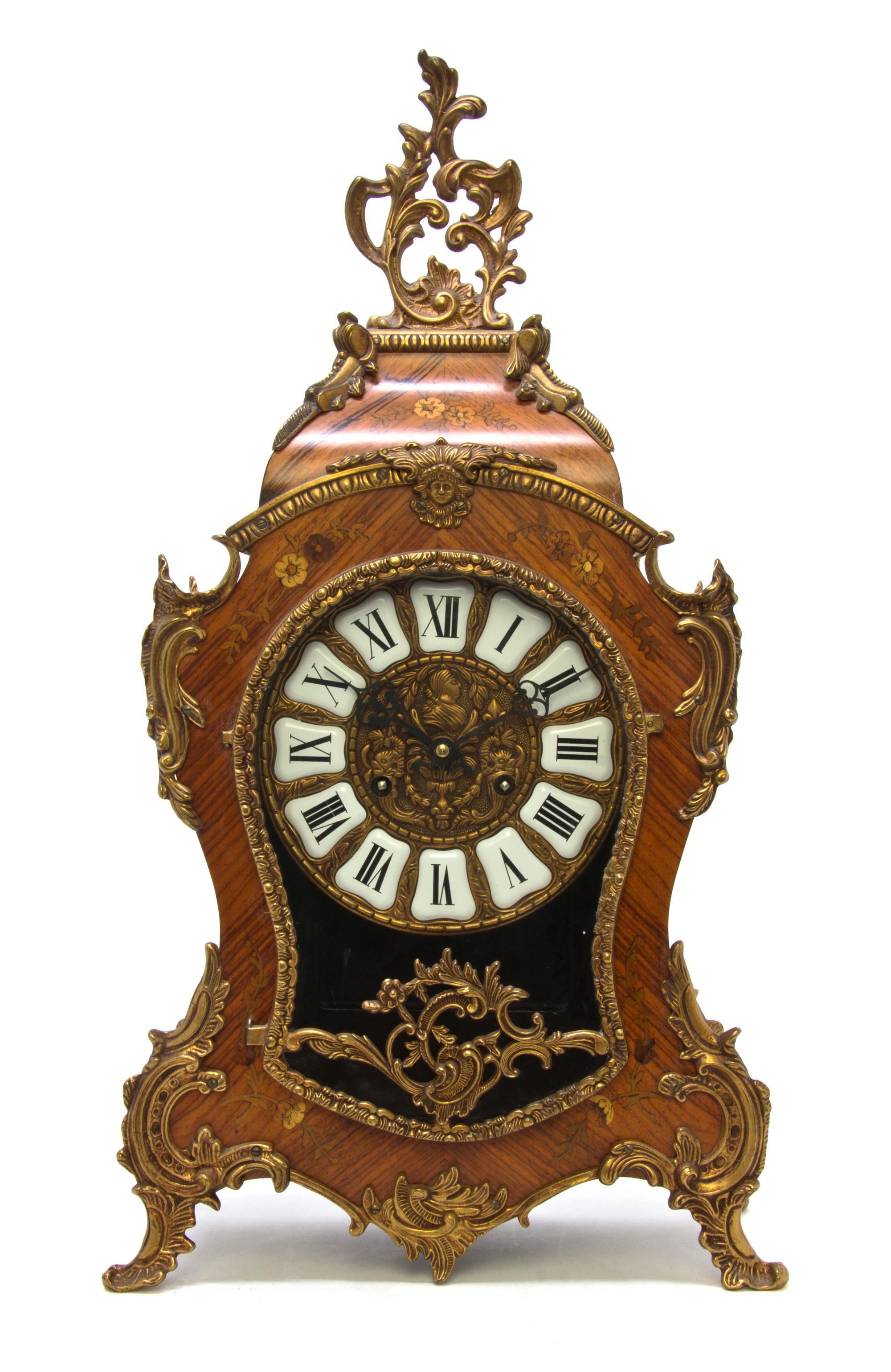 A Louis XV Style Marquetry and Gilt Metal Mounted Bracket Clock, Height 22 1/2 inches.