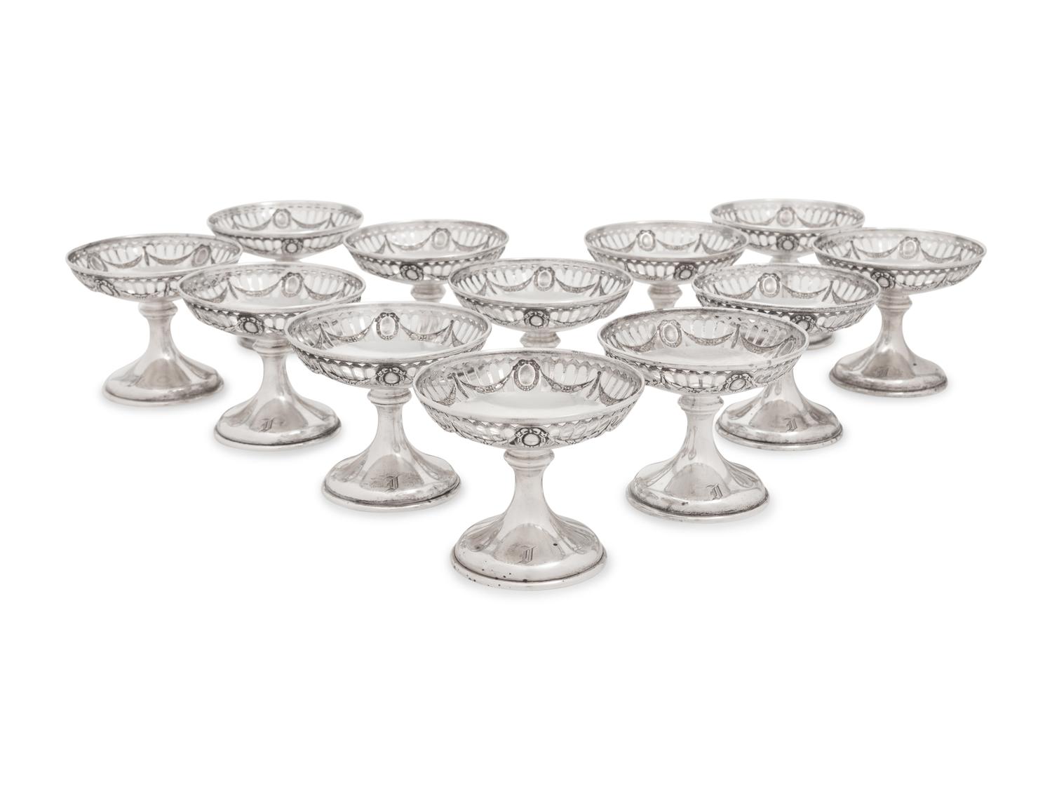 A Group of American Silver Cups and Saucers
