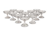 A Group of American Silver Cups and Saucers