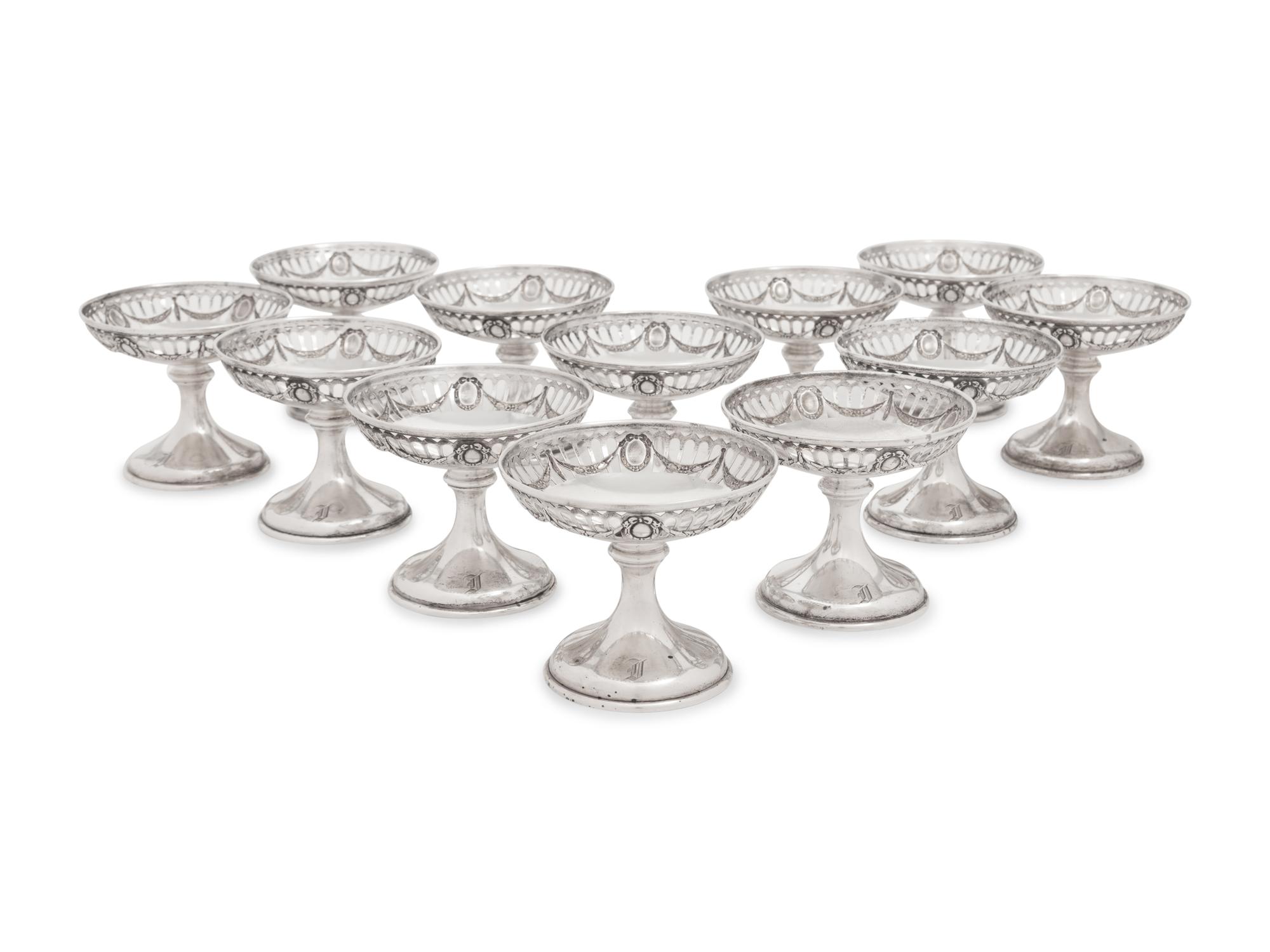 A Group of American Silver Cups and Saucers