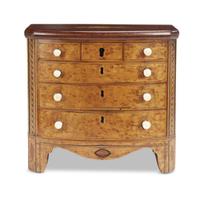 Inlaid bird's-eye maple tea caddy in the form of a miniature chest of drawers circa 1800