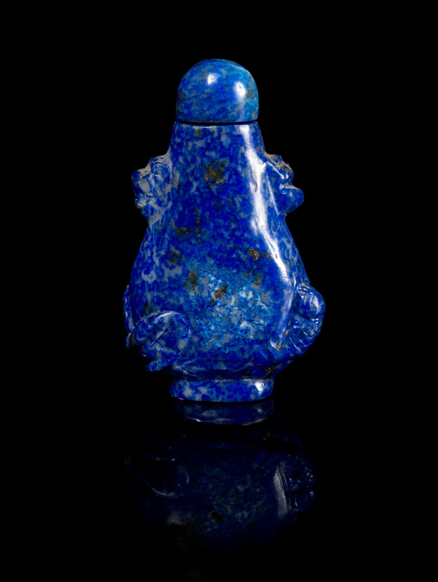 Two Carved Snuff Bottles Height of first 3 inches.