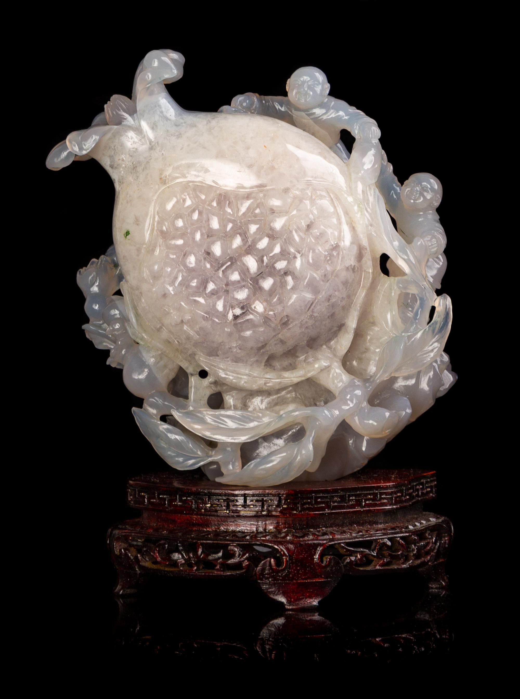 A Chinese Carved 'Boy and Pomegranate' Group