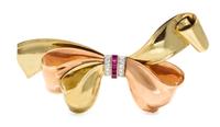 A Retro 14 Karat Bicolor Gold, Platinum, Diamond and Ruby Bow Brooch, Eckfeldt & Ackley, 21.60 dwts.