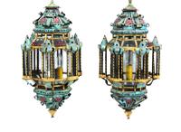 A Pair of Tole and Glass Hanging Lanterns Height 24 1/2 inches.